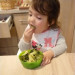 Image of Little Girl Chooses to eat Broccoli Over Chocolates and Candies
