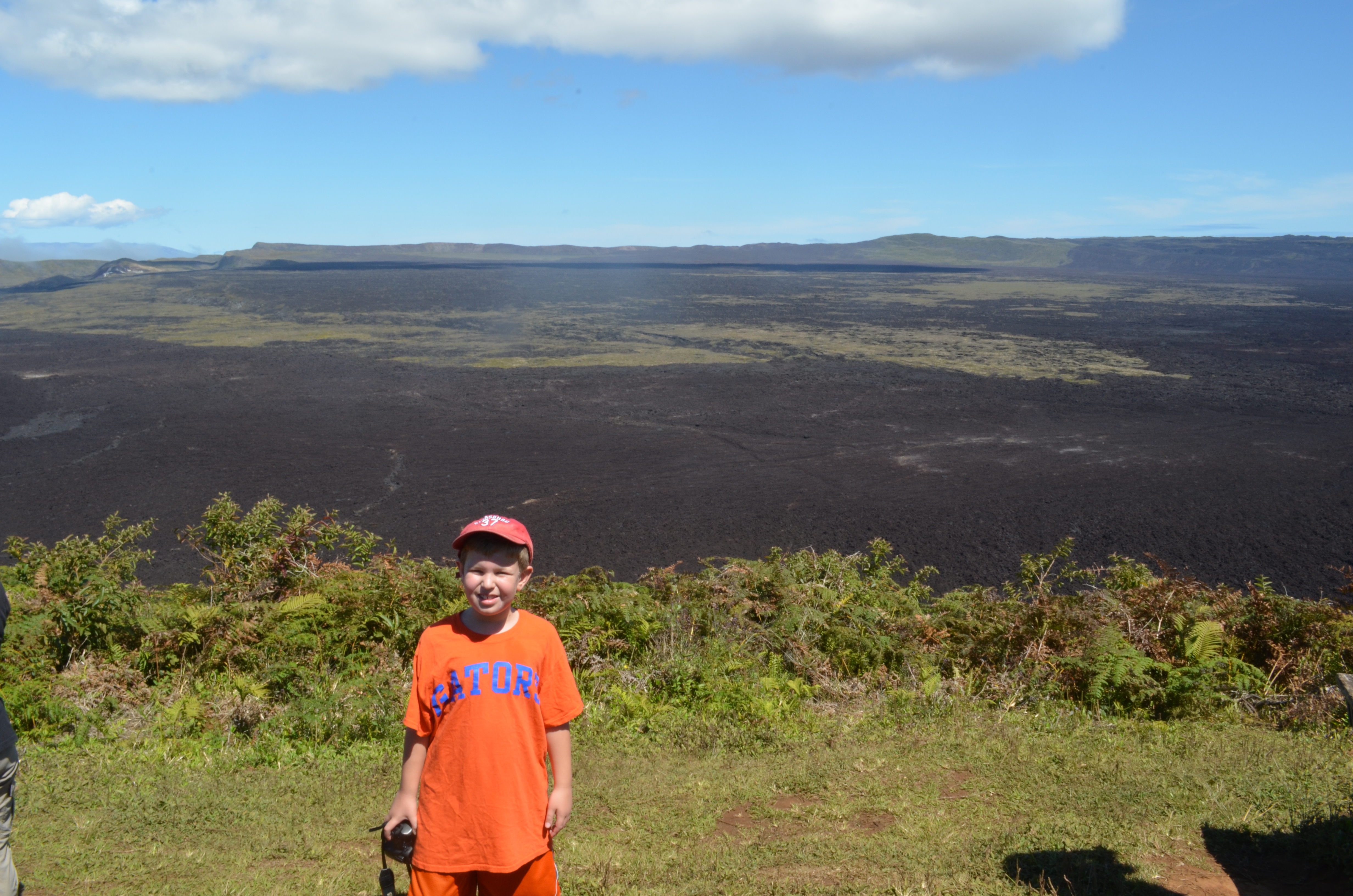 standing next to volcano